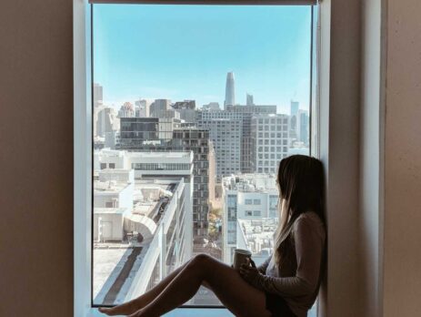 woman sitting beside window